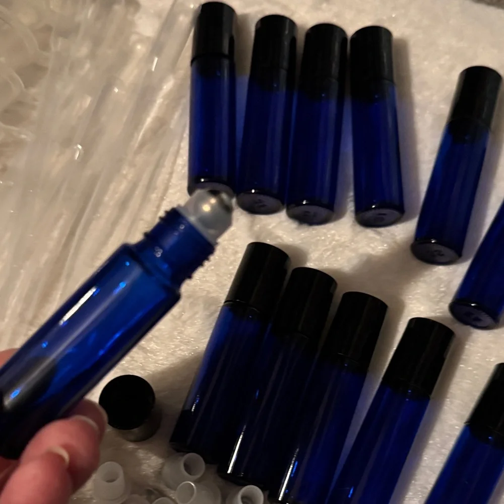 Pink and Black Travel Case with 12 Blue Roll On Bottles with Funnels Pipettes